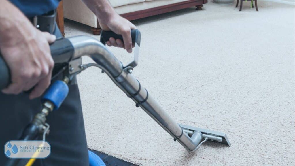 Professional steam cleaner machine in action on a carpet.